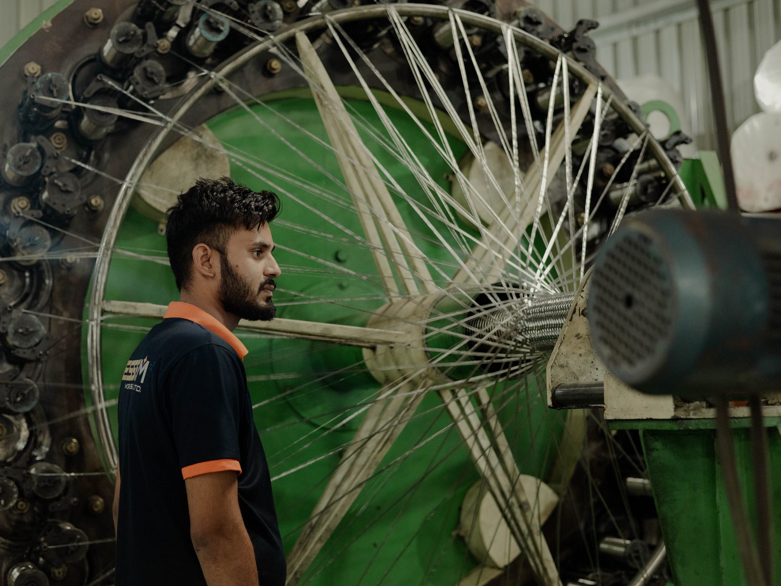 Braiding a stainless steel hose at the Essem Works unit, Moraiya, Ahmedabad