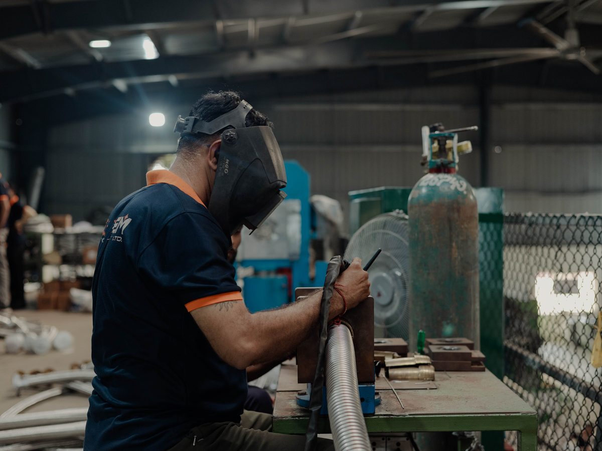 TIG welding an end fitting to a hose assembly